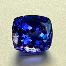 Gorgeous, tanzanite, old mine material, blue-blue with hint of violet, occasional red flashes. Cushion cut with precision faceting.