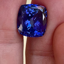 Gorgeous, tanzanite, old mine material, blue-blue with hint of violet, occasional red flashes. Cushion cut with precision faceting.