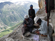 Miners at 2000-3000 ft. elevation mining gems in Himalayas 