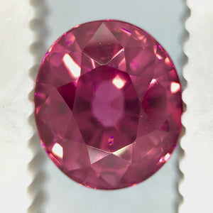 Umbalite garnet loose gem on diamond viewer.